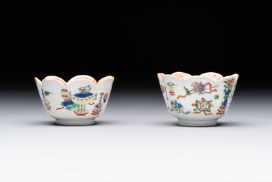 A pair of Chinese famille verte cups and saucers with antiquities, Kangxi