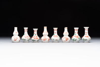 Eight Chinese wucai and gilt-iron-red miniature vases with floral design, Kangxi