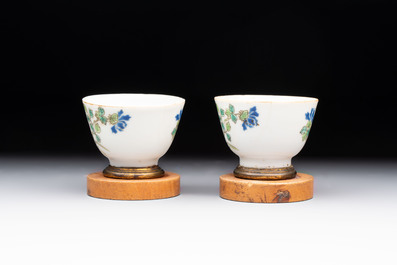 A Chinese blue and white 'prunus on cracked ice' jar, a tea caddy, a covered teapot, and four famille rose cups, 19th C.