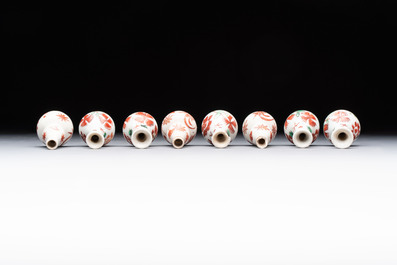 Eight Chinese wucai and gilt-iron-red miniature vases with floral design, Kangxi