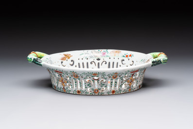 A polychrome Dutch Delft petit feu reticulated basket after a Chinese famille rose example, 18th C.