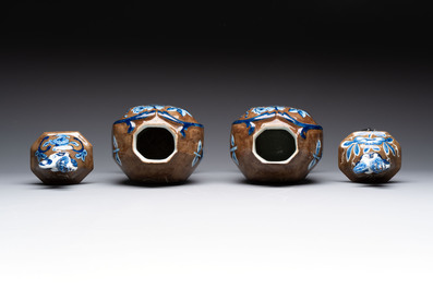 A rare pair of blue and white Dutch Delft brown-ground vases and covers, 18th C.
