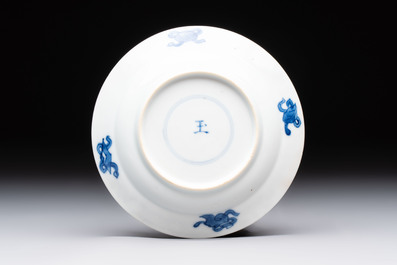 A Chinese blue and white 'Rotterdam Riot' cup and saucer, jade mark, Kangxi