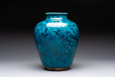 A polychrome pottery hookah base and a Persian turquoise-glazed pottery jar, late Qajar period, Iran, 19/20th C.