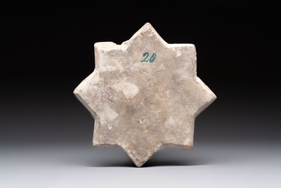 A Kashan lustre-glazed relief-moulded star tile, Iran, 13th C.