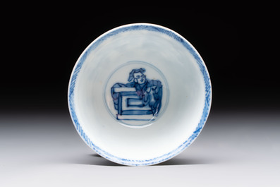 A Chinese blue and white 'Rotterdam Riot' cup and saucer, jade mark, Kangxi