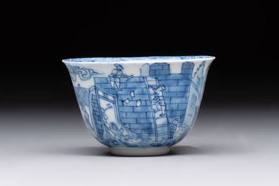 A Chinese blue and white 'Rotterdam Riot' cup and saucer, jade mark, Kangxi