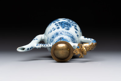A fine blue and white Dutch Delft chinoiserie jug with brass lid, 17th C.
