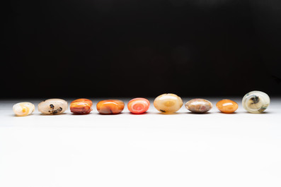 A collection of nine Chinese agate snuff bottles, 20th C.