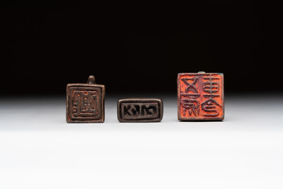 Five Chinese bronze seals and an Indonesian bronze figure group, 18/19th C.