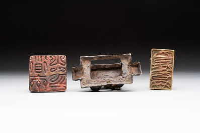 Five Chinese bronze seals and an Indonesian bronze figure group, 18/19th C.