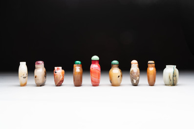 A collection of nine Chinese agate snuff bottles, 20th C.