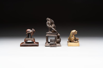 Five Chinese bronze seals and an Indonesian bronze figure group, 18/19th C.