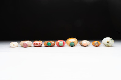 A collection of nine Chinese agate snuff bottles, 20th C.