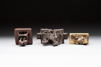 Five Chinese bronze seals and an Indonesian bronze figure group, 18/19th C.