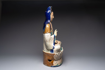 A large Chinese polychrome-glazed Shiwan stoneware figure of Guanyin, 19th C.