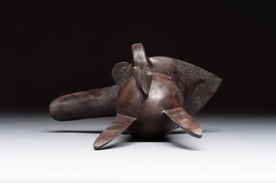 A Chinese archaic bronze wine vessel with Taotie design, 'Jue 爵', Zhou