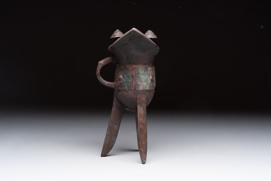 A Chinese archaic bronze wine vessel with Taotie design, 'Jue 爵', Zhou