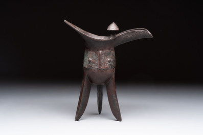 A Chinese archaic bronze wine vessel with Taotie design, 'Jue 爵', Zhou