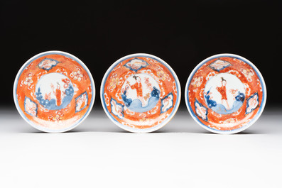 Eight Chinese blue, white and iron-red cups and twelve saucers, Kangxi/Yongzheng