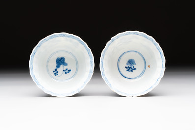 Eight Chinese blue, white and iron-red cups and twelve saucers, Kangxi/Yongzheng