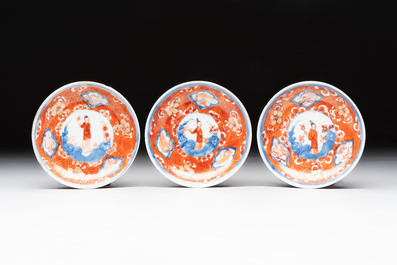 Eight Chinese blue, white and iron-red cups and twelve saucers, Kangxi/Yongzheng