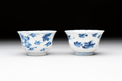 Eight Chinese blue, white and iron-red cups and twelve saucers, Kangxi/Yongzheng