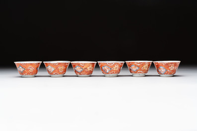 Eight Chinese blue, white and iron-red cups and twelve saucers, Kangxi/Yongzheng