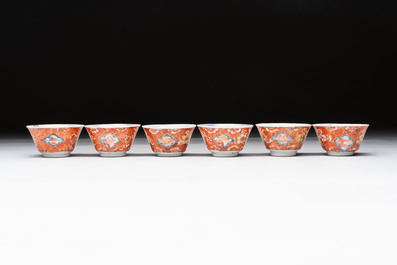 Eight Chinese blue, white and iron-red cups and twelve saucers, Kangxi/Yongzheng