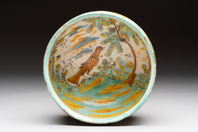 A large polychrome Spanish pottery dish and a bowl with a bird, Talavera, 18th C.