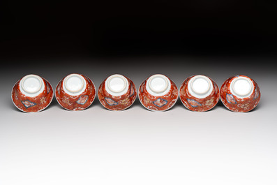 Eight Chinese blue, white and iron-red cups and twelve saucers, Kangxi/Yongzheng