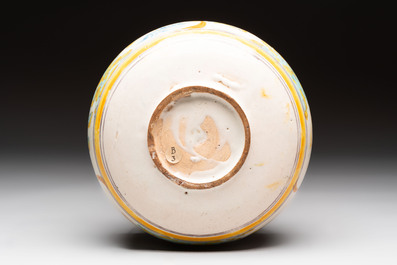 A large polychrome Spanish pottery dish and a bowl with a bird, Talavera, 18th C.