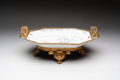A Chinese famille rose dish with a crane among flowering branches with bronze mount, Qianlong