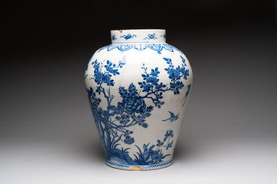 A large blue and white Dutch Delft Kangxi-style chinoiserie 'pheasant among peonies' vase, early 18th C.