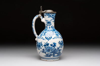 A blue and white Dutch Delft jug with pewter cover, 1st quarter 18th C.