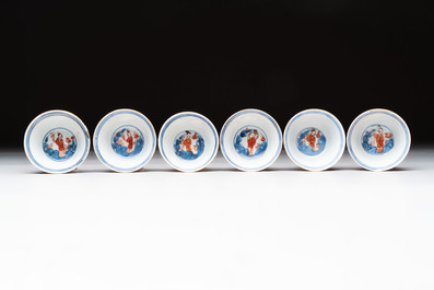 Eight Chinese blue, white and iron-red cups and twelve saucers, Kangxi/Yongzheng