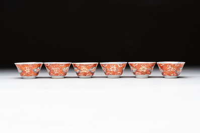 Eight Chinese blue, white and iron-red cups and twelve saucers, Kangxi/Yongzheng