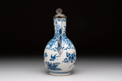 A blue and white Dutch Delft jug with pewter cover, 1st quarter 18th C.
