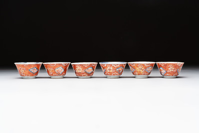 Eight Chinese blue, white and iron-red cups and twelve saucers, Kangxi/Yongzheng