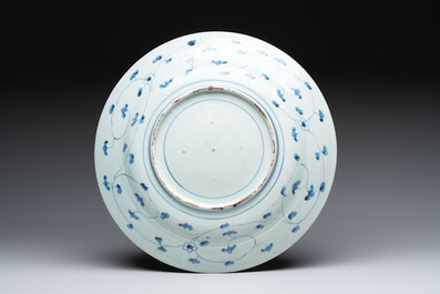 Three Japanese blue and white flower-shaped plates and a 'fisherman' dish, Edo, 17/18th C.