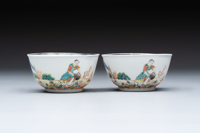 A pair of Chinese famille rose 'European subject' cups and saucers, Qianlong