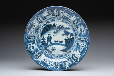 Three Japanese blue and white flower-shaped plates and a 'fisherman' dish, Edo, 17/18th C.