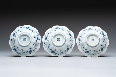 Three Japanese blue and white flower-shaped plates and a 'fisherman' dish, Edo, 17/18th C.