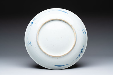 Five Chinese blue and white 'birds and flowers' and 'peony scroll' plates and dishes, 18/19th C.