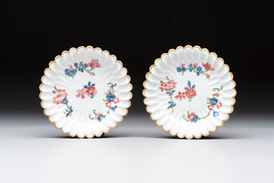 Two Chinese gilt-decorated famille rose cups and saucers with floral design, Qianlong