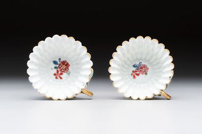 Two Chinese gilt-decorated famille rose cups and saucers with floral design, Qianlong