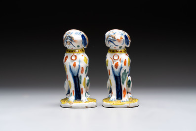 A pair of polychrome Dutch Delft dogs, 18th C.