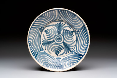 Three blue and white Spanish pottery plates, a dish and a tazza with floral design, Talavera, 19th C.
