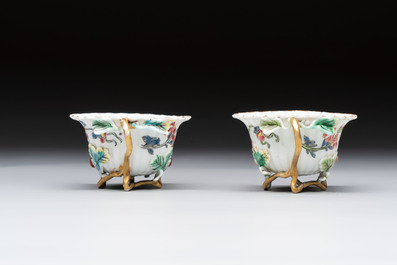 Two Chinese gilt-decorated famille rose cups and saucers with floral design, Qianlong