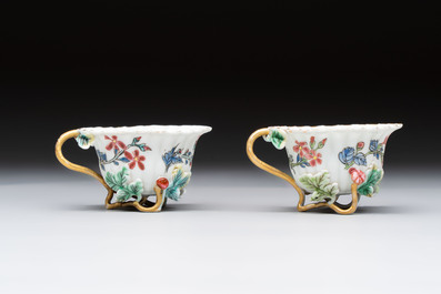 Two Chinese gilt-decorated famille rose cups and saucers with floral design, Qianlong